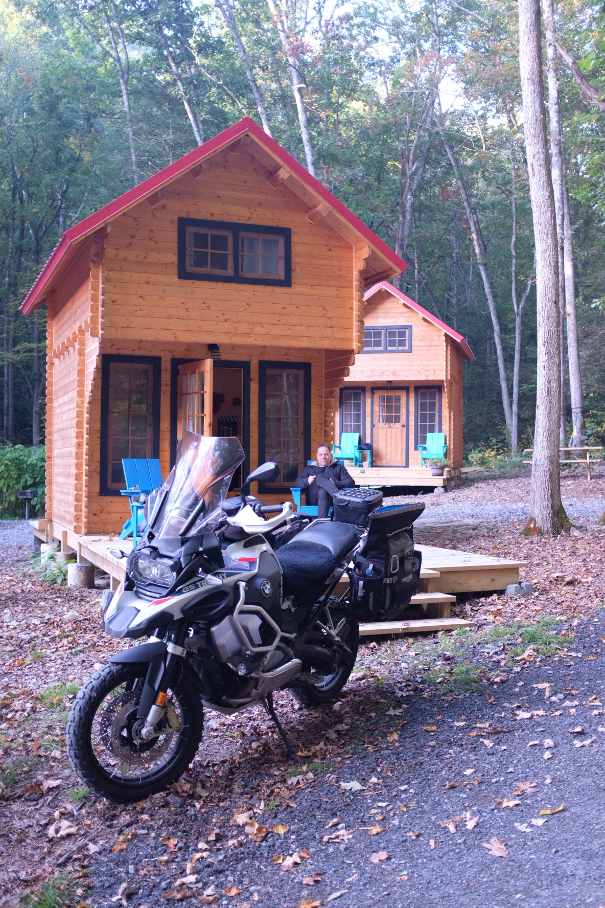 BMW adventure motorcycle parked in front of the cabins