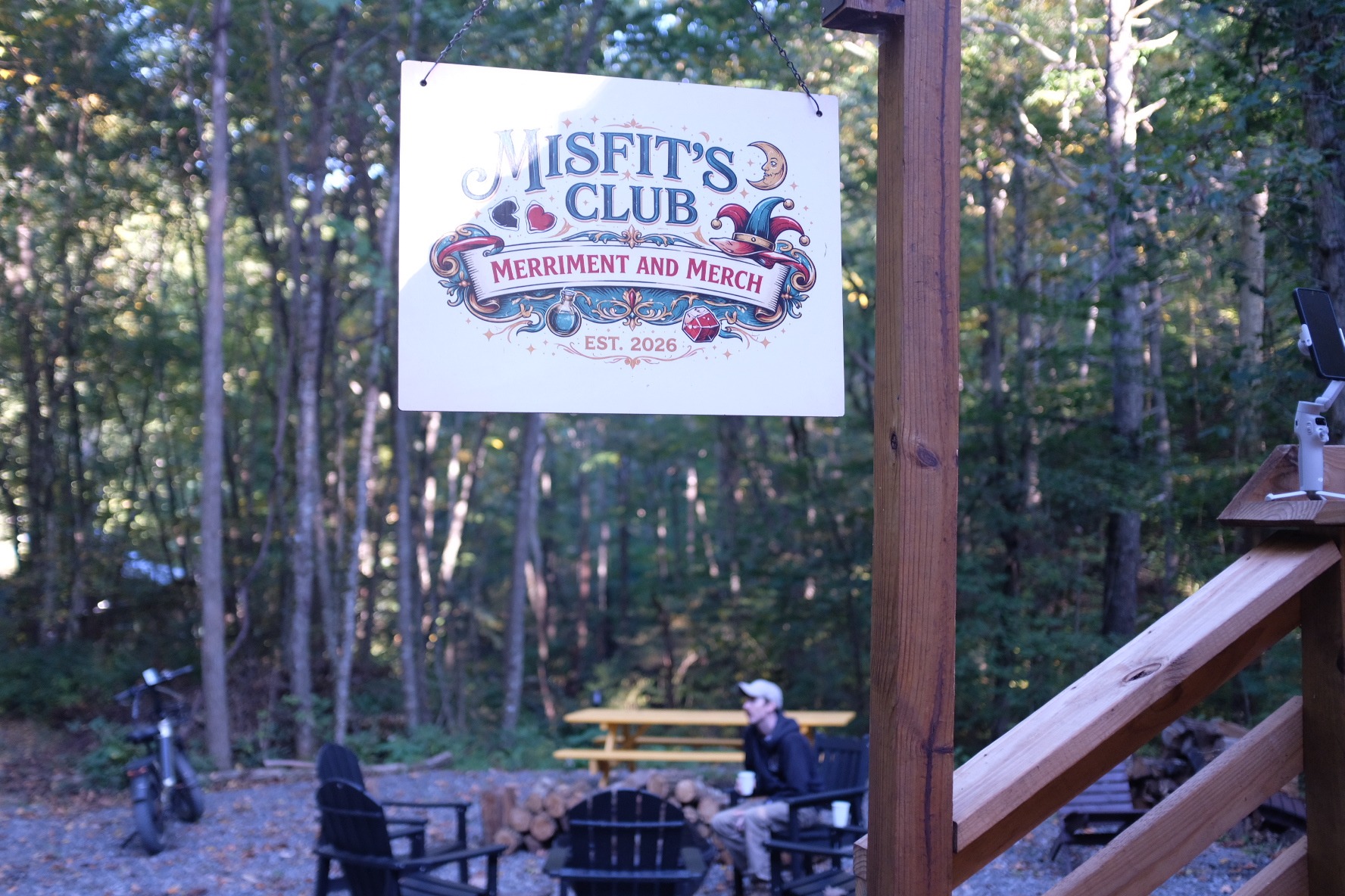 Misfit's Club sign beside the outdoor fire-pit gathering area