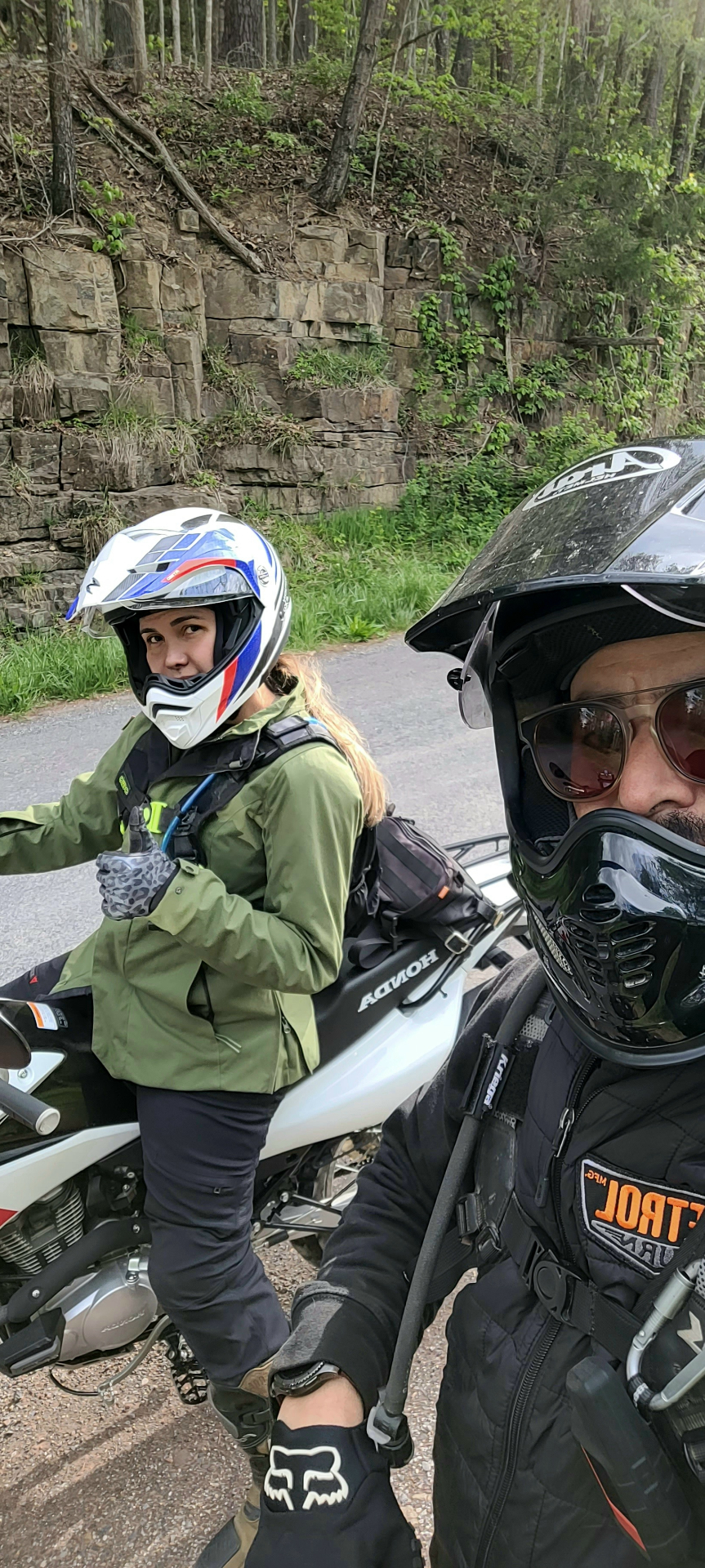 Alejandra and Anthony geared up on a Blue Ridge backroad, mid-ride