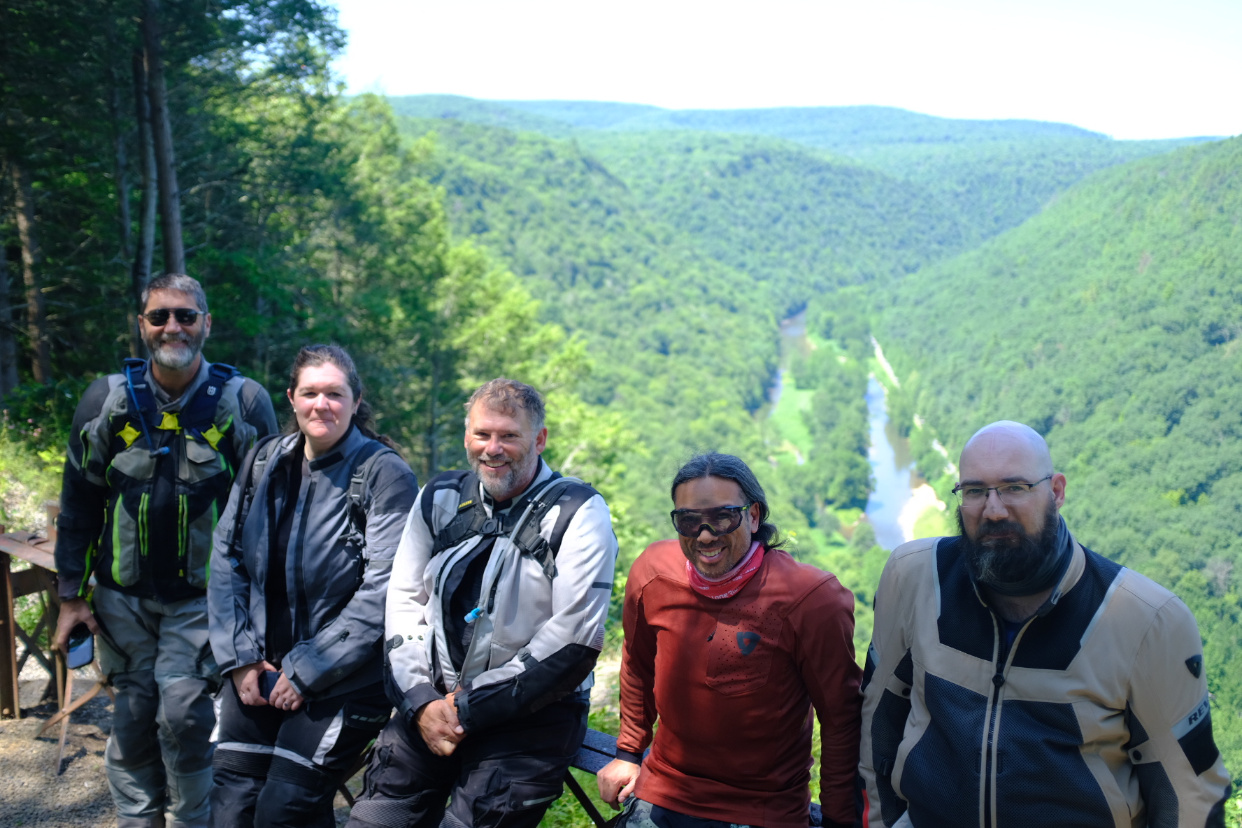 The full group of riders posing at a PA Grand Canyon overlook