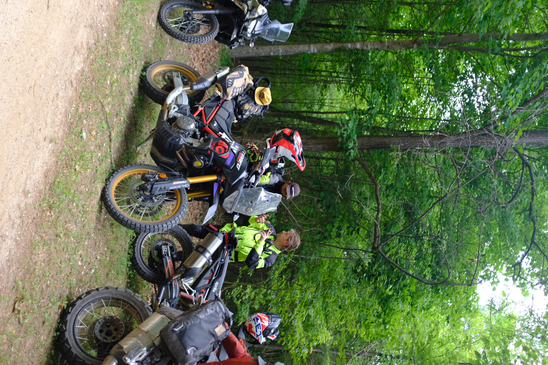 Aprilia Tuareg and KTM adventure bikes parked together on the ride