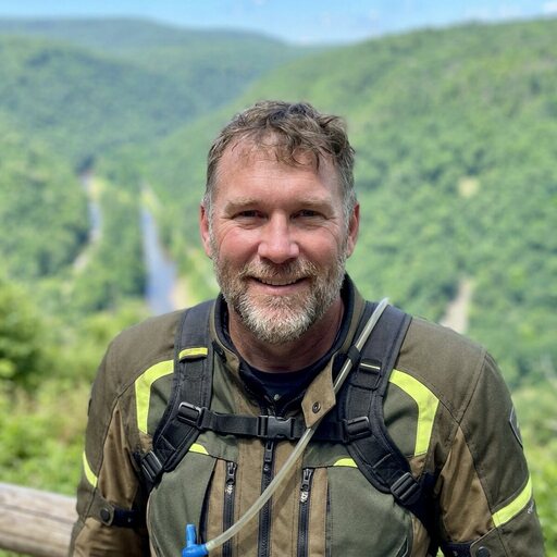 Adventure rider at a scenic Appalachian mountain overlook